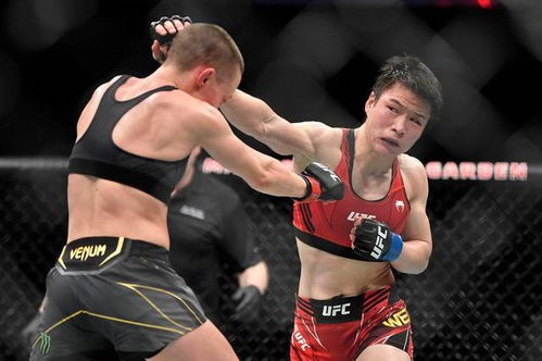 UFC312：张伟丽压制女小鹰苏亚雷斯，成功卫冕草量级金腰带
