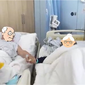 彭女士与丈夫在病房中交谈
