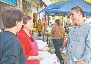 吴越在菜市场与商贩交流