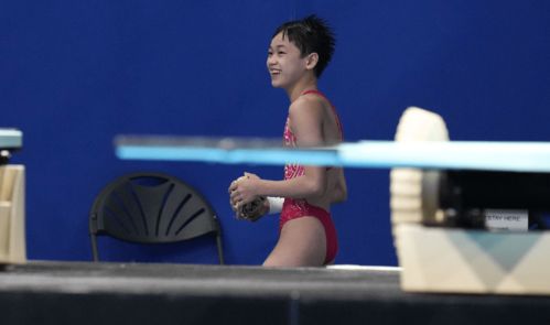 全红婵与教练合影